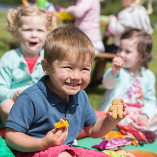 Children tucking into Organix Goodies snacks
